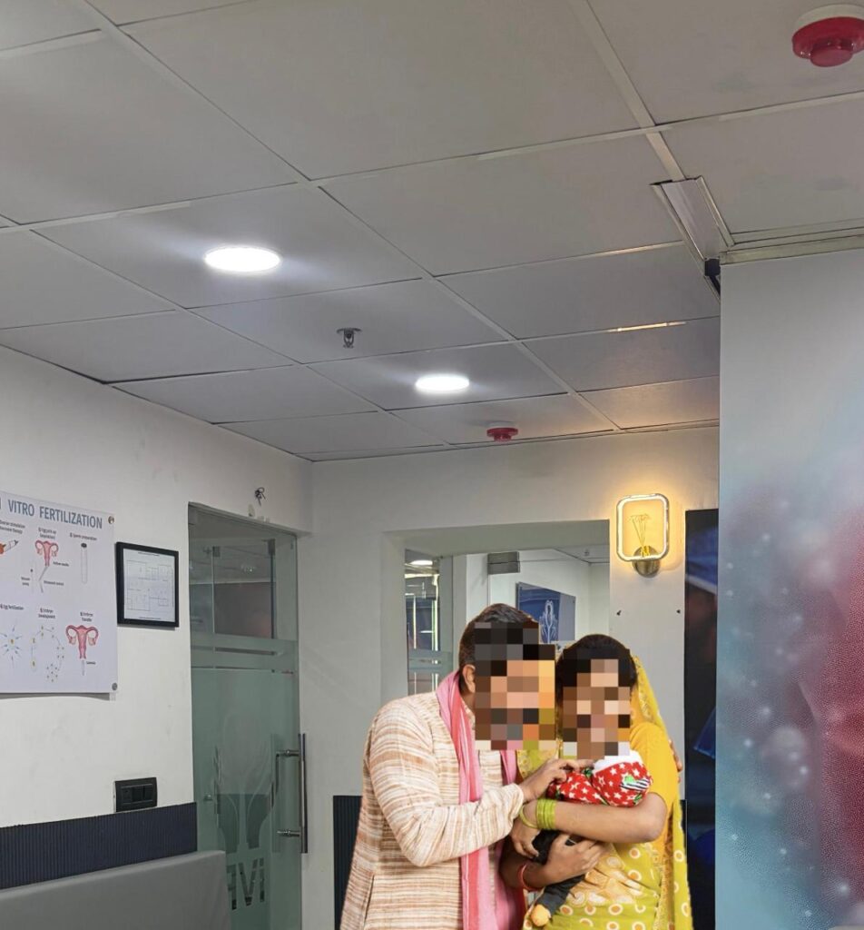 Happy parent holding a newborn baby at GHRACE & HOPE IVF representing a successful fertility treatment and parenthood journey.